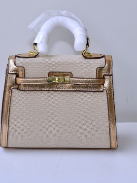 Elegant Gold and Beige Leather Handbag with Gold Detailing